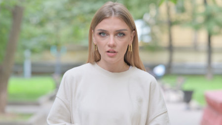 Blogging Young Woman Doing Video Chat Outdoorの写真素材