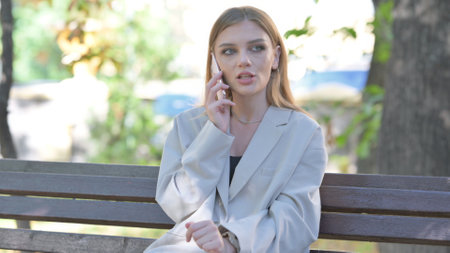 Young Businesswoman Talking on phone Outdoorの写真素材