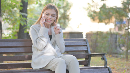 Young Business Lady Talking on phone Outdoorの写真素材