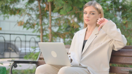 Young Business Lady on Laptop Outdoorの写真素材