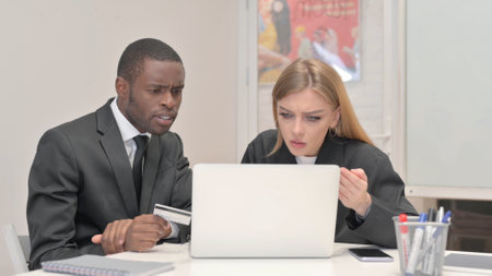 Business People Upset with Online Payment Failure in Officeの写真素材