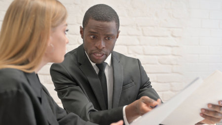 Business People Working on Documents in Officeの写真素材
