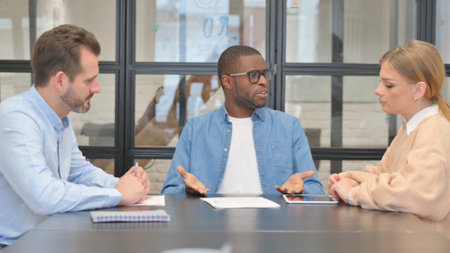Angry African Entrepreneur Discussing Paperwork, Argumentの写真素材