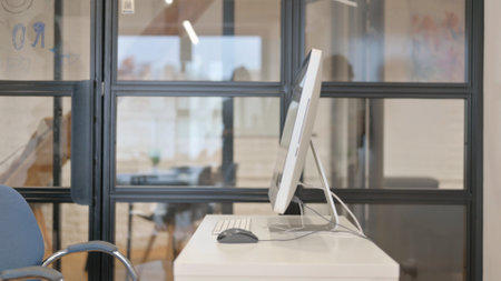 African Man Leaving Office after Working on Computer