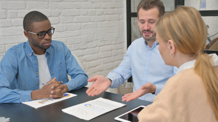 Man Discussing Business Report in Office, Discussionの写真素材