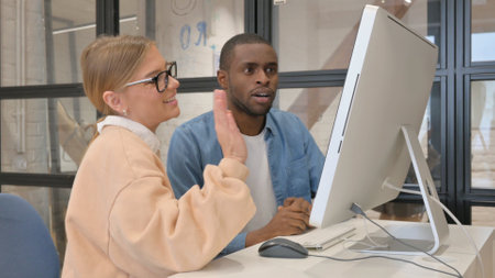 Interracial Couple Doing Video Chat on Computerの写真素材