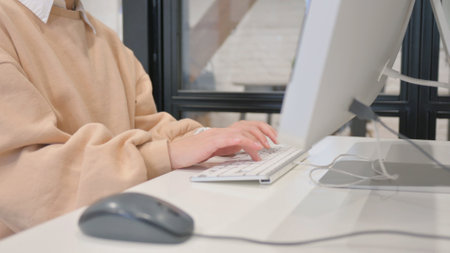 Close up of Female Hands Typing on Keyboardの写真素材