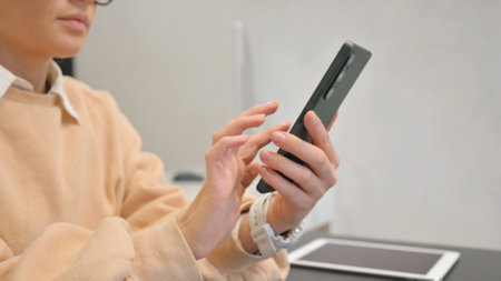 Close up of Woman Browsing Smartphoneの写真素材