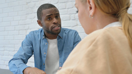 African Man Talking with Female Colleagueの写真素材