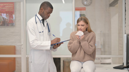 Female Patient with Cold Flu Consulting an African Doctorの写真素材