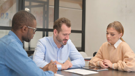 Man Discussing Paperwork in Office, Discussionの写真素材