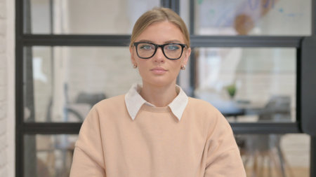 Portrait of Serious Young Woman in Officeの写真素材