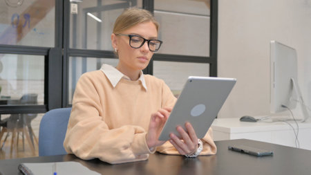 Female Worker Using Digital Tablet in Officeの写真素材