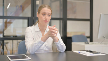 Angry Mature Business Woman Feeling Frustrated at Workの写真素材