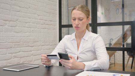 Mature Business Woman Having Online Shopping Failure on Phoneの写真素材