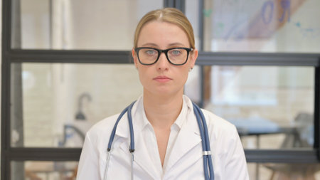 Portrait of Female Doctor Standing in Hospitalの写真素材
