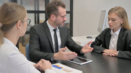 Businessman Talking with Teammates in Meeting, Problemsの写真素材