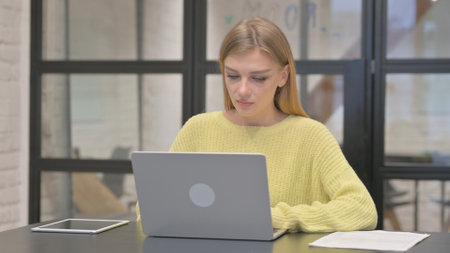 Casual Creative Woman Working on Laptopの写真素材