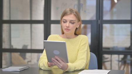 Casual Creative Woman Working on Digital Tabletの写真素材