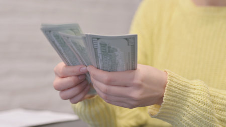 Close Up of Woman Counting Money