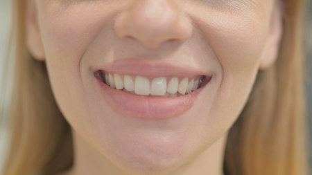 Close up of Smiling Mouth of Young Womanの写真素材