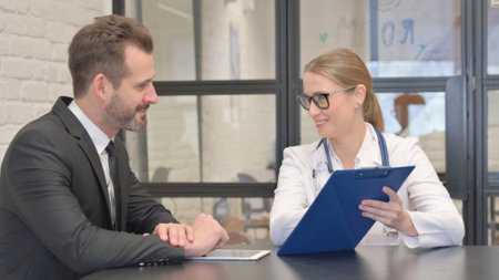 Female Doctor Discussing Treatment Plan with Patientの写真素材