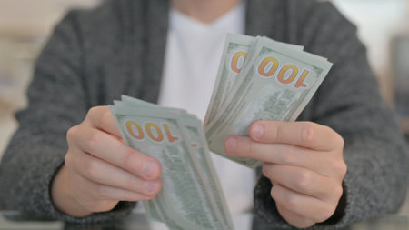 Close up of Man Counting Money