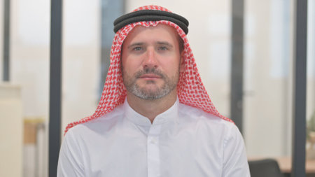 Portrait of Serious Arab Man in Officeの写真素材