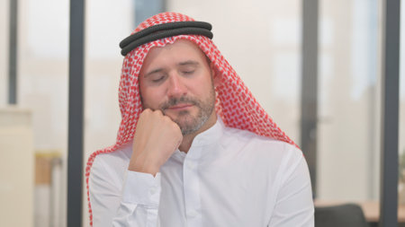 Portrait of Yawning Tired Arab Man Need Sleepの写真素材