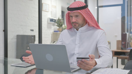 Middle Aged Muslim Man Facing Online Payment Problemの写真素材