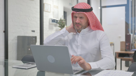 Tired Middle Aged Muslim Man having Need Restの写真素材