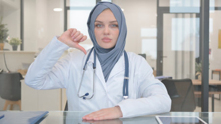 Thumb Down by Young Doctor in Hijabの写真素材