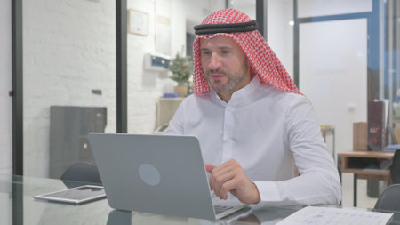 Middle Aged Muslim Man Talking with Customer Online, Video Conferenceの写真素材