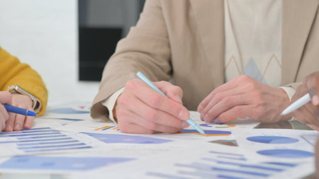Hands of Business People Doing Paperworkの写真素材