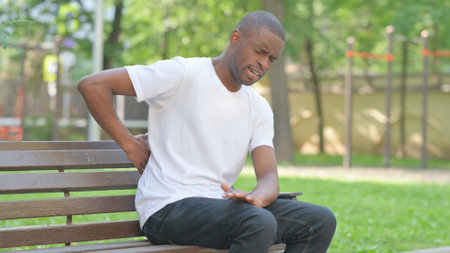Young African Man with Spinal Injury Sitting Outdoorの写真素材