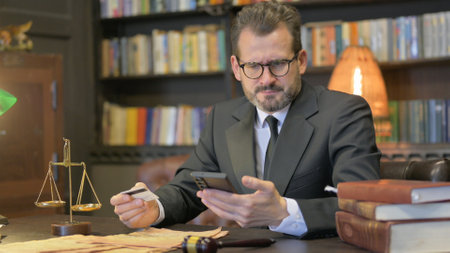Middle Aged Lawyer Having Online Banking Problemの写真素材