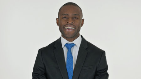 Portrait of Smiling African Businessman on White Backgroundの写真素材
