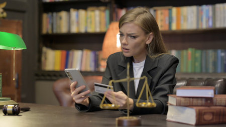Female Lawyer with Online Banking Problem in Officeの写真素材