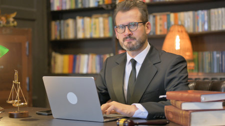 Middle Aged Lawyer Working on Laptopの写真素材