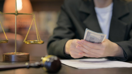 Close up of Female Lawyer Handling Moneyの写真素材