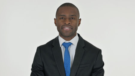Portrait of Serious African Businessman on White Backgroundの写真素材