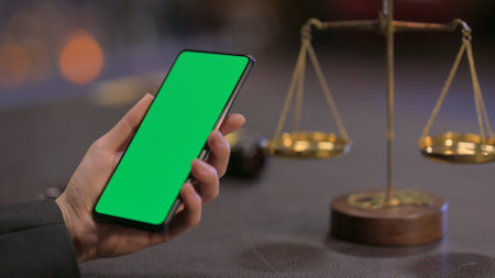 Female Lawyer Using Chroma Key Smartphone in Officeの写真素材