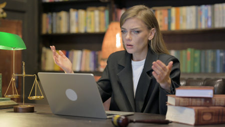 Female Lawyer Shocked by Loss on Laptopの写真素材