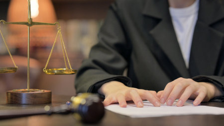 Close up of Female Judge Frustrated Female Lawyer Trying to Writeの写真素材