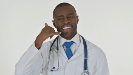 Portrait of African Doctor inviting People for Help, Call Me on White Backgroundの写真素材