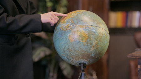 Close up of Male Hand Working with Globe of Worldの写真素材