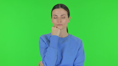 Tired Woman on Green Backgroundの写真素材