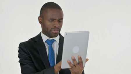 Portrait of African Businessman Using Digital Tablet on White Backgroundの写真素材