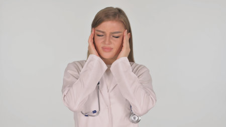 Portrait of Businesswoman with Migraine on White Backgroundの写真素材