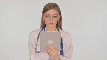 Portrait of Female Doctor Using Digital Tablet on White Backgroundの写真素材